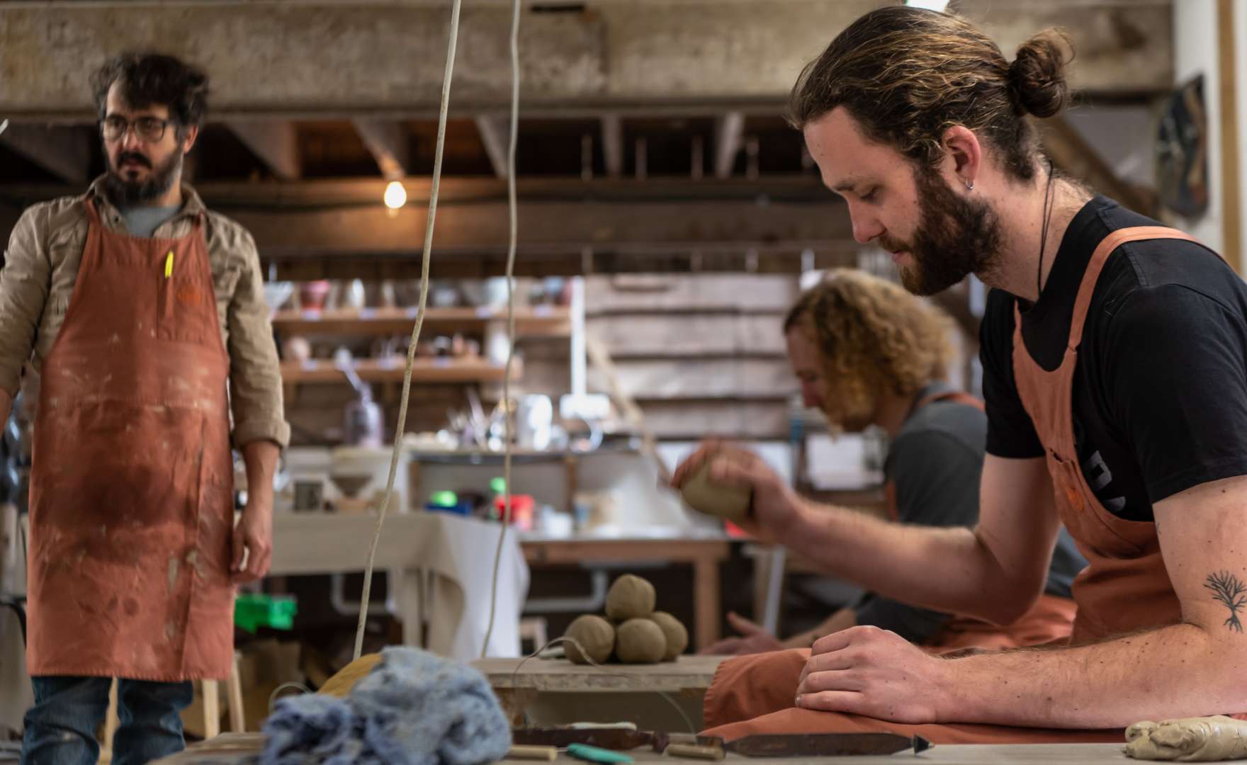 Visitor putting their clay ball on the wheel