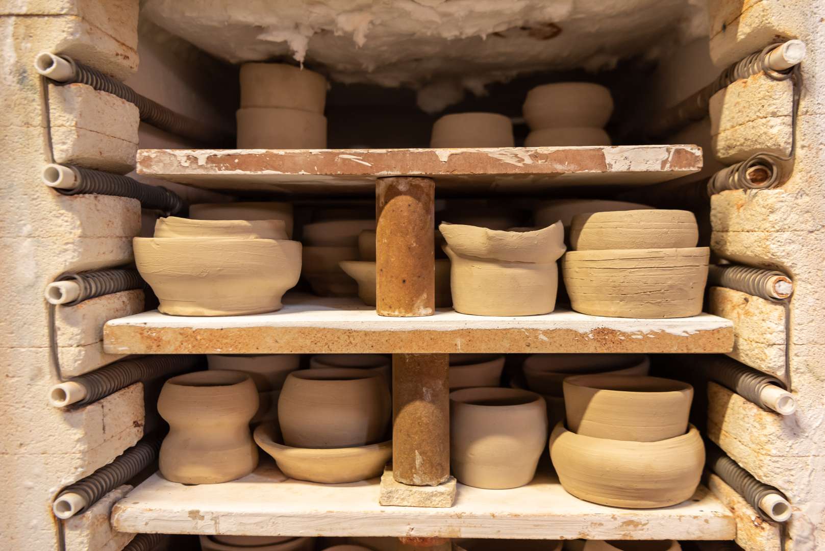 Visitors' pottery items in the kiln to be fired