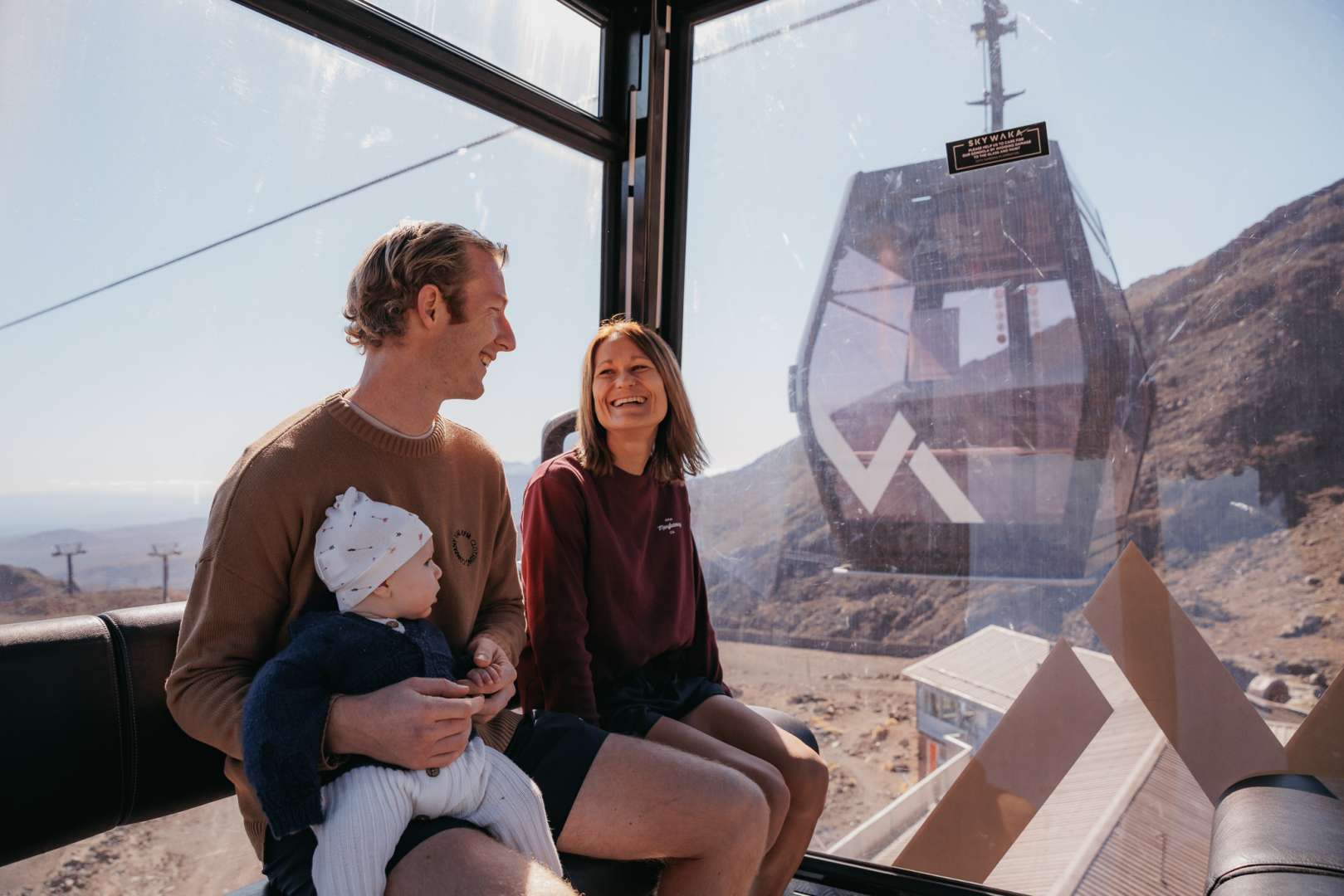 A happy family at the top of the Sky Waka gondola